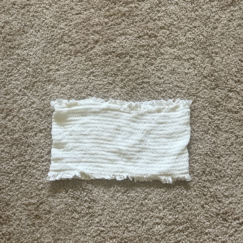 Small white tube top, cropped.